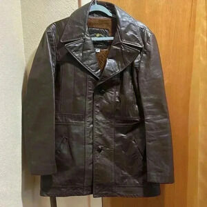 Vintage leather coat with zip out faux fur lining. Size 40.